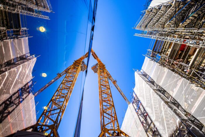 modern crane at a construction site - photo