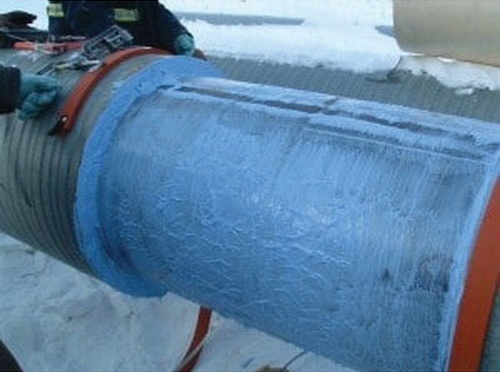 a pipe being lines with corrosion under insulation